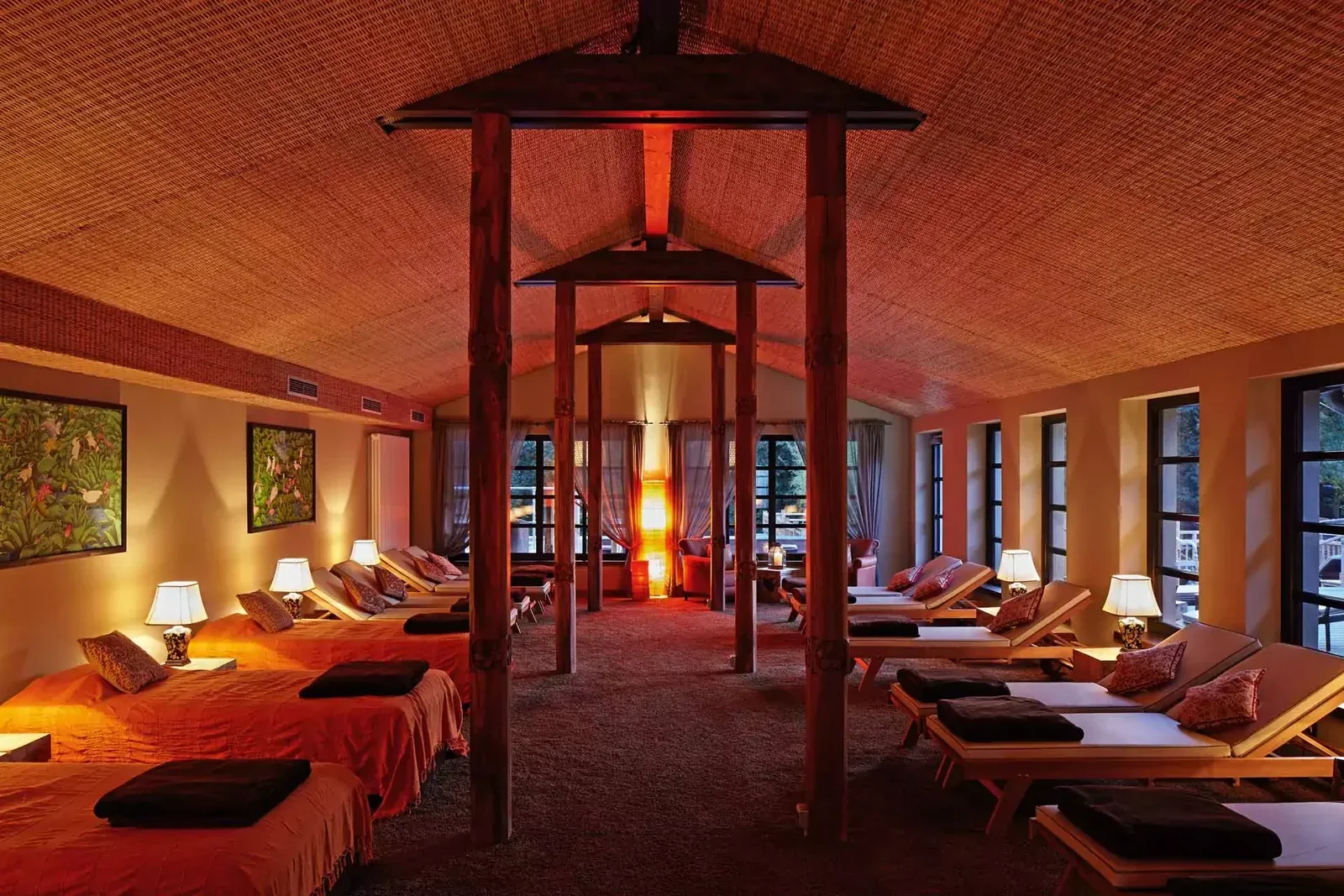 Spa relaxation room with loungers and warm lighting