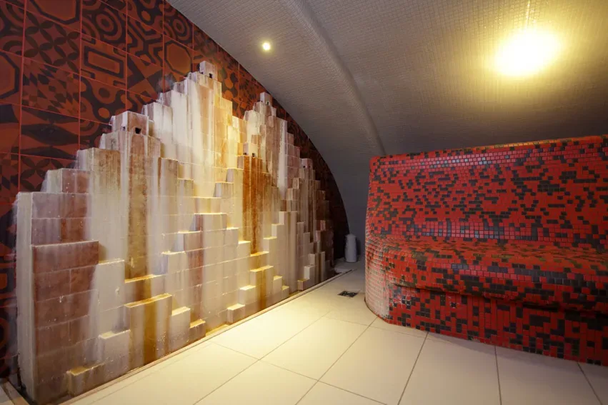 Tiled thermal bath interior with warm lighting